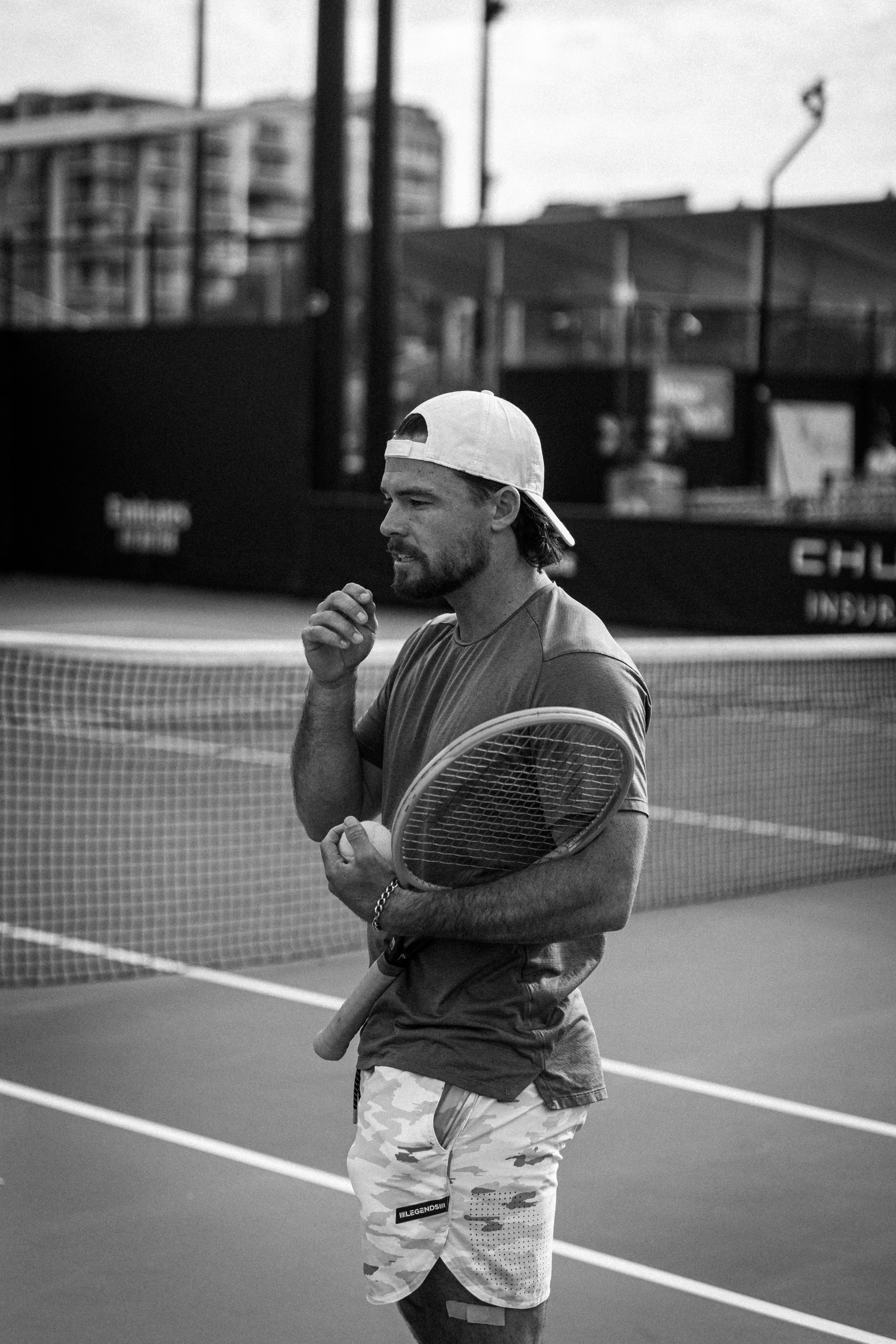 Eddie, ATP/WTA coach, courtside at a pro tournament